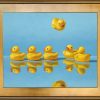 Ducks in a Row with a gold frame